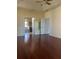 Bedroom with wood floors, ceiling fan, and en-suite bathroom access at 1332 Hunterman Lane, Winter Garden, FL 34787