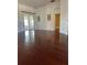 Spacious bedroom with wood floors and access to other rooms at 1332 Hunterman Lane, Winter Garden, FL 34787