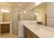 Bathroom with a walk-in shower, double vanity, and modern finishes at 5807 Wallis Ln, Saint Cloud, FL 34771