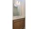 Clean bathroom featuring a vanity with a large mirror at 5807 Wallis Ln, Saint Cloud, FL 34771