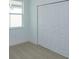 Bright bedroom with large closet and neutral carpeting at 5807 Wallis Ln, Saint Cloud, FL 34771