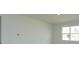 Bright bedroom with large window and neutral wall colors at 5807 Wallis Ln, Saint Cloud, FL 34771