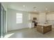 Modern kitchen with island, stainless steel appliances, and white cabinets at 5807 Wallis Ln, Saint Cloud, FL 34771