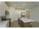 Modern kitchen with white cabinets, stainless steel appliances, and an island at 5807 Wallis Ln, Saint Cloud, FL 34771