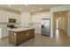 Spacious kitchen, featuring white cabinets and an island at 5807 Wallis Ln, Saint Cloud, FL 34771