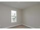 Spacious bedroom with a large window and neutral walls at 5820 Springer St, Saint Cloud, FL 34771