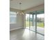 Bright dining area with sliding glass doors leading to the patio at 5820 Springer St, Saint Cloud, FL 34771