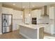 Modern kitchen with white cabinets, stainless steel appliances, and an island at 5820 Springer St, Saint Cloud, FL 34771