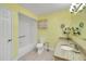 Full bathroom with tile floors, granite vanity, and shower-tub combo at 17548 Se 96Th Ave, Summerfield, FL 34491