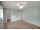 This bedroom has neutral paint, carpet, and features a walk-in closet at 17548 Se 96Th Ave, Summerfield, FL 34491
