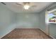 This is a standard bedroom with carpet and a window at 17548 Se 96Th Ave, Summerfield, FL 34491