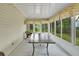 Screened-in patio with an outdoor table at 17548 Se 96Th Ave, Summerfield, FL 34491