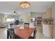 Bright eat-in kitchen featuring stainless steel appliances, tile floors, and dining table set at 17548 Se 96Th Ave, Summerfield, FL 34491