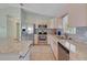 Modern kitchen with stainless steel appliances, granite counters, and ample storage space at 17548 Se 96Th Ave, Summerfield, FL 34491