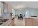 Bright kitchen features granite countertops, stainless steel appliances, and tile backsplash at 17548 Se 96Th Ave, Summerfield, FL 34491