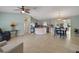 Spacious living room featuring neutral walls, tile flooring, and ample natural light from adjacent rooms at 17548 Se 96Th Ave, Summerfield, FL 34491