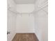 Walk-in closet includes carpet and open shelving, ready for custom organization at 17548 Se 96Th Ave, Summerfield, FL 34491