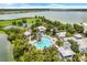 Aerial view of community amenities, including a pool, clubhouse, and green spaces at 1103 White Water Bay Dr, Groveland, FL 34736