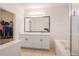 Bright bathroom featuring double vanity, soaking tub, and a glass-enclosed shower at 1103 White Water Bay Dr, Groveland, FL 34736