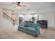 Open-concept living area connects the kitchen, dining, and living spaces with tile floors at 1103 White Water Bay Dr, Groveland, FL 34736