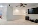 Cozy loft featuring neutral colors, a ceiling fan, and an entertainment area at 1103 White Water Bay Dr, Groveland, FL 34736