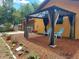 Outdoor gazebo patio area with seating. Beautifully landscaped with mulch and decorative lighting at 14700 Se 94Th Ave, Summerfield, FL 34491