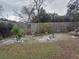 Landscaped backyard with wooden fence and patio at 14700 Se 94Th Ave, Summerfield, FL 34491