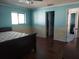 Primary bedroom with tiled floors and a view of the bathroom at 14700 Se 94Th Ave, Summerfield, FL 34491