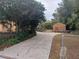 Long driveway leading to the house, with a wooden shed visible at 14700 Se 94Th Ave, Summerfield, FL 34491