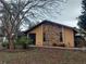 House exterior with stone accents and landscaping at 14700 Se 94Th Ave, Summerfield, FL 34491