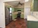 Eat-in kitchen featuring stainless steel appliances and green cabinets at 14700 Se 94Th Ave, Summerfield, FL 34491