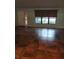 Spacious living room with large window and tile flooring at 14700 Se 94Th Ave, Summerfield, FL 34491