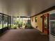 Relaxing screened-in patio offering ample space for outdoor seating and entertaining with view of lush landscaping at 14700 Se 94Th Ave, Summerfield, FL 34491