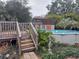 Above ground pool with wooden deck and steps at 14700 Se 94Th Ave, Summerfield, FL 34491