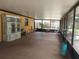 Expansive screened-in porch with ample space for seating and entertaining, providing an inviting outdoor living area at 14700 Se 94Th Ave, Summerfield, FL 34491