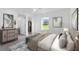 Bright primary bedroom features a large window, stylish furnishings, and ensuite bath at 14853 Sw 26Th Ln, Ocala, FL 34481