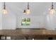 Open-concept living area with tile flooring, ceiling fan, and large window at 14853 Sw 26Th Ln, Ocala, FL 34481