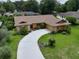 Single-story house with a large backyard and curved driveway at 213 Stevenage Dr, Longwood, FL 32779