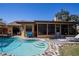 Backyard oasis featuring a custom pool with stone decking, lush grass, and patio at 213 Stevenage Dr, Longwood, FL 32779