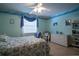 Coastal bedroom features a light color palette, ceiling fan, and decoratives at 213 Stevenage Dr, Longwood, FL 32779