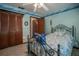 Bedroom features a ceiling fan, closet, and decoratives at 213 Stevenage Dr, Longwood, FL 32779