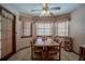 Charming breakfast nook features a wooden table and chairs, and large windows at 213 Stevenage Dr, Longwood, FL 32779