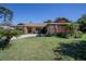 Lovely home showcasing a manicured front yard, a stone facade, and a welcoming entrance at 213 Stevenage Dr, Longwood, FL 32779
