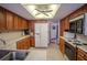 Spacious kitchen with wood cabinets, white countertops, and stainless steel appliances at 213 Stevenage Dr, Longwood, FL 32779