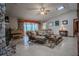 Cozy living room with stone fireplace, skylights, and comfortable seating at 213 Stevenage Dr, Longwood, FL 32779