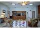 Open living room showcasing a large entertainment center and views into other areas of the home at 213 Stevenage Dr, Longwood, FL 32779