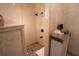 Walk-in shower with neutral tiling and a decorative pebble floor at 213 Stevenage Dr, Longwood, FL 32779