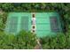 Community tennis courts, surrounded by trees, offer a great recreational amenity at 213 Stevenage Dr, Longwood, FL 32779
