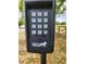 Mighty Mule keypad on a post, features number buttons, light button, and directional arrow button at 13832 Bay Lake Rd, Groveland, FL 34736