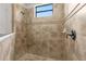 Clean shower with neutral-toned tile at 25499 Hawks Run Ln, Sorrento, FL 32776